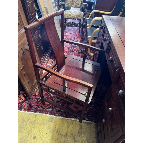 101 - A Chinese hardwood kneehole desk, length 131cm, depth 65cm, height 83cm and elbow chair