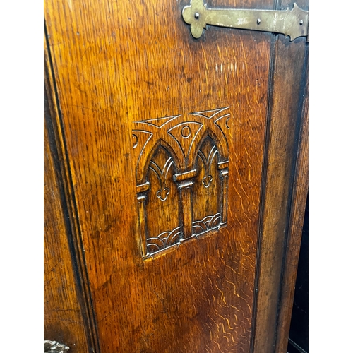 123 - A 17th century style carved oak hall cupboard, width 76cm, depth 46cm, height 167cm