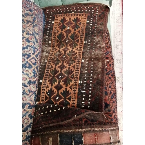 129 - Six antique Belouch bags and faces, largest 200 x 52cm