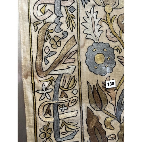 138 - A polychrome embroidered panel, framed,  the panel width 51cm, height 192cm