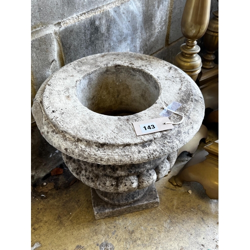 143 - A reconstituted stone campana garden urn, diameter 36cm, height 38cm