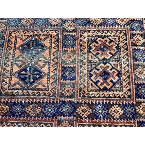 151 - A Belouch blue ground geometric rug 240cm x 140cm