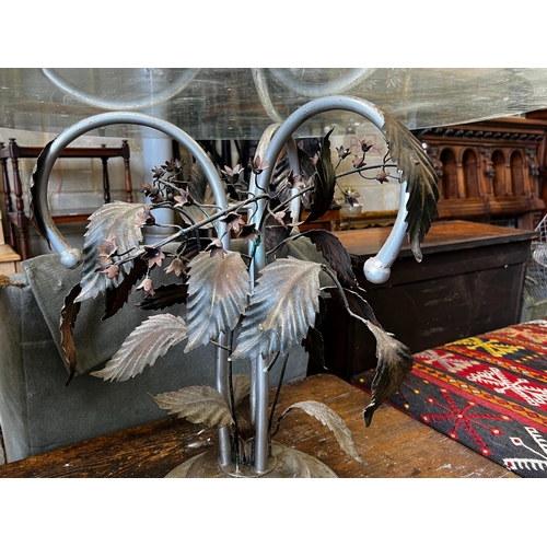 160 - A circular glass topped coffee table on metal underframe, diameter 76cm, height 56cm