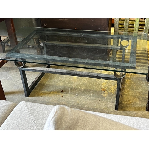 164 - A rectangular glass topped cast metal coffee table, width 137cm, depth 76cm, height 46cm