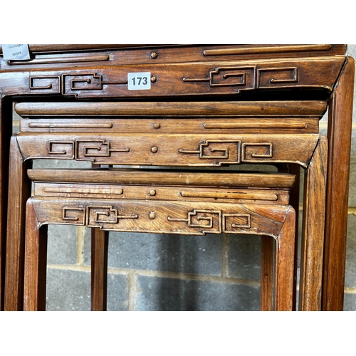 173 - A nest of three Chinese rectangular hardwood tea tables, width 49cm, depth 35cm, height 59cm