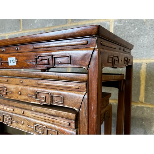 173 - A nest of three Chinese rectangular hardwood tea tables, width 49cm, depth 35cm, height 59cm