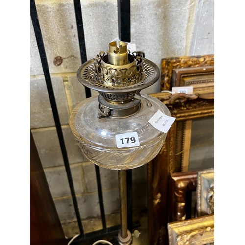 179 - A late Victorian adjusting brass oil lamp standard (converted) on associated telescopic cast iron st... 