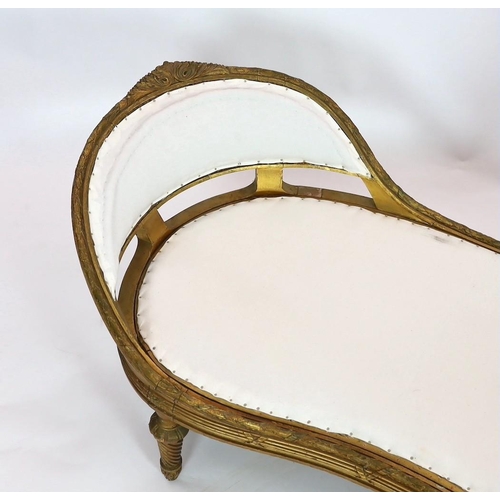 183 - A 19th century Louis XVI style giltwood chaise longue, with reeded ribbon tied rails, acanthus leaf ... 