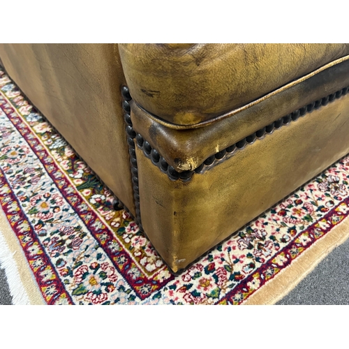 186 - A pair of brown leather brass studded three seater settees, length 200cm, depth 90cm, height 84cm... 