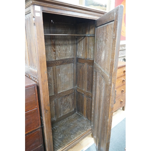 206 - A 17th century style linenfold moulded oak hall cupboard, width 91cm, depth 53cm, height 179cm... 