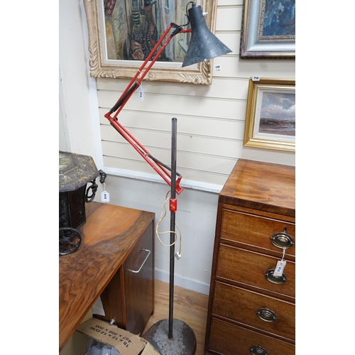 215 - A converted industrial style anglepoise standard lamp on cast metal wheeled stand