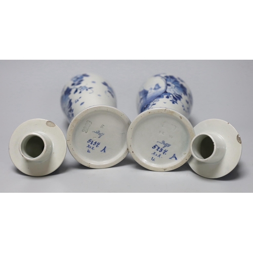 253 - A pair of blue and white Delft vases and covers, 28cm