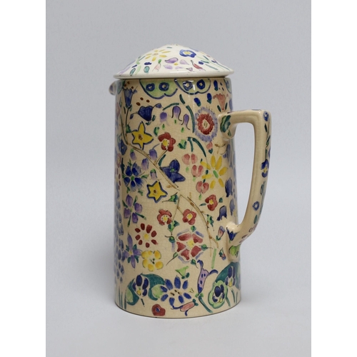 261 - Jessie Marion King (1875-1949), a covered floral jug, 18.5cm