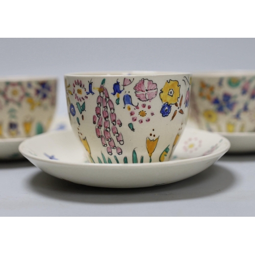 267 - Jessie Marion King. A set of six floral teacups and saucers