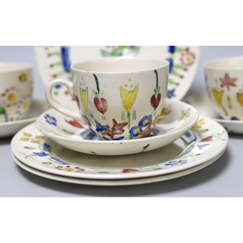 269 - Jessie Marion King (1875-1949). Three different floral design tea cups, saucers and plates