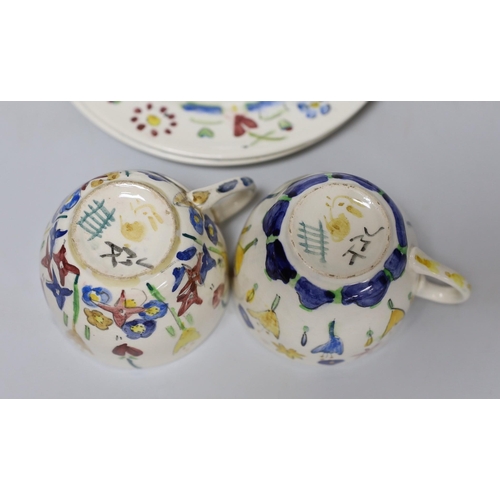 269 - Jessie Marion King (1875-1949). Three different floral design tea cups, saucers and plates