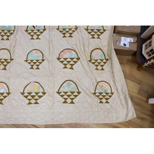 272 - A North American embroidered silk quilt