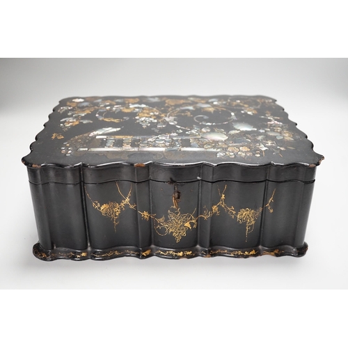 273 - A Victorian papier mache workbox and contents, 32cm