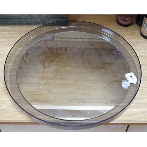 286 - An Italian 1970's circular perspex wall mirror by Guzzini, designed by L. Massoni, 56.5cms diameter... 