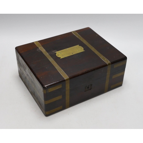 295 - A Victorian brass bound rosewood toilet box, with contents, 21cms deep x 27cms wide