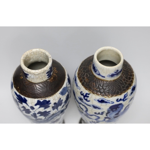 296 - A pair of 19th century Chinese crackleglaze blue and white vases, 27cm