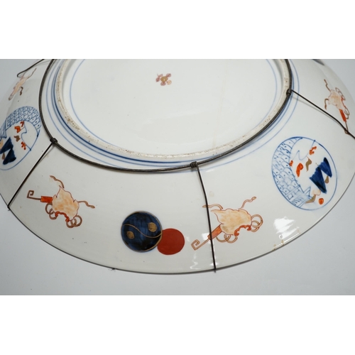 300 - A Japanese Imari dragon and phoenix charger, Meiji period, 46cm diameter