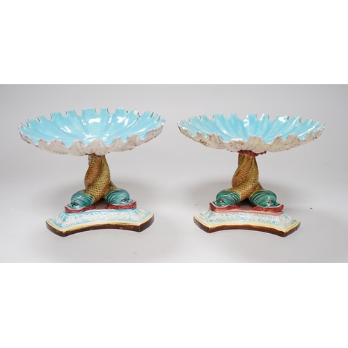 305 - A pair of late 19th century Royal Worcester majolica dolphin comports, 10cm tall