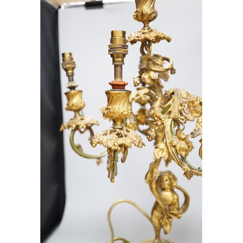 306 - An ornate six branch ormolu cherub candelabrum, converted to a lamp, 54cms high