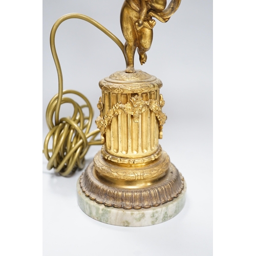 306 - An ornate six branch ormolu cherub candelabrum, converted to a lamp, 54cms high