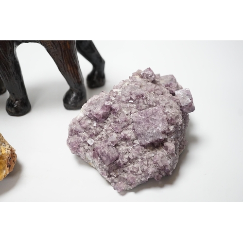 309 - Two specimens; amethyst and rock crystal, and a leather model of an Indian elephant, 24cm high... 