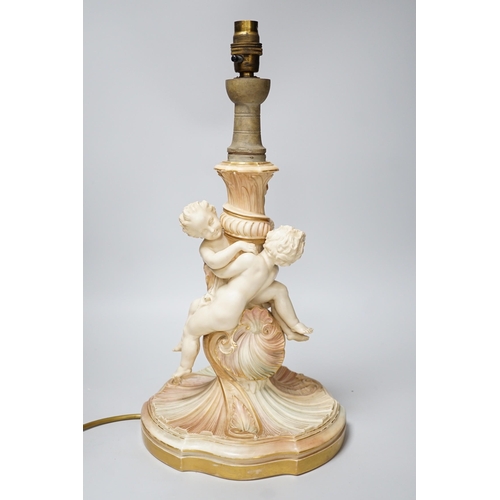 311 - A large Royal Worcester blush ivory cherub lamp base, 40cms not including light fitting