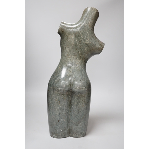 312 - Daniel Baradza (Zimbabwean). A large carved stone female torso, 52cms high