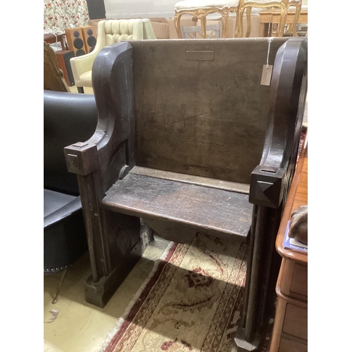 32 - A 17th century and later oak pew with carved misericord, width 82cm, depth 40cm, height 109cm