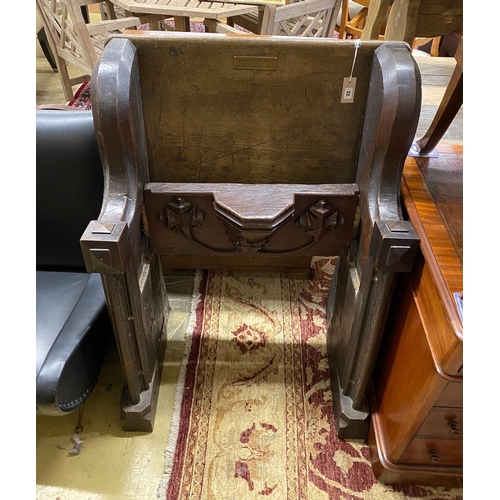 32 - A 17th century and later oak pew with carved misericord, width 82cm, depth 40cm, height 109cm