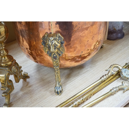 323 - A set of three Victorian brass fire irons, a pair of fire dogs and a copper log bin