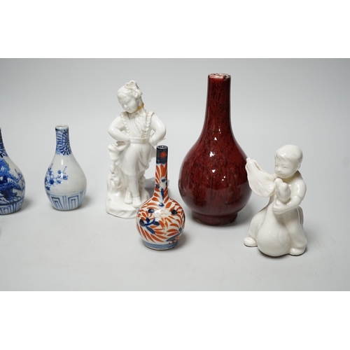 353 - A Chinese sang de boeuf bottle neck vase, together with four Chinese miniature vases, three Chinese ... 