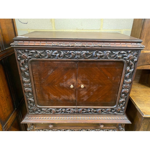 4 - A 17th century style oak cocktail cabinet on stand, width 90cm, depth 50cm, height 137cm