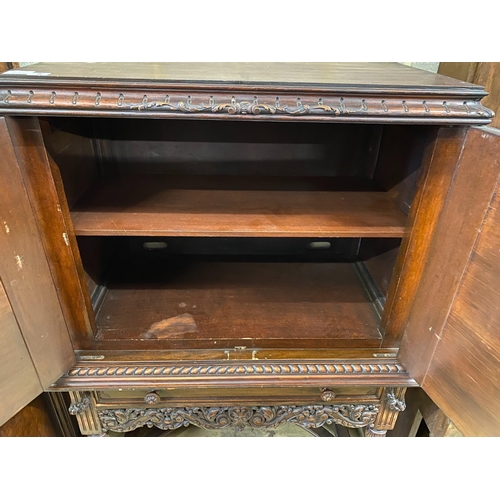 4 - A 17th century style oak cocktail cabinet on stand, width 90cm, depth 50cm, height 137cm