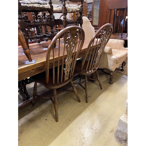 40 - Five reproduction Windsor elm and beech dining chairs, one with arms