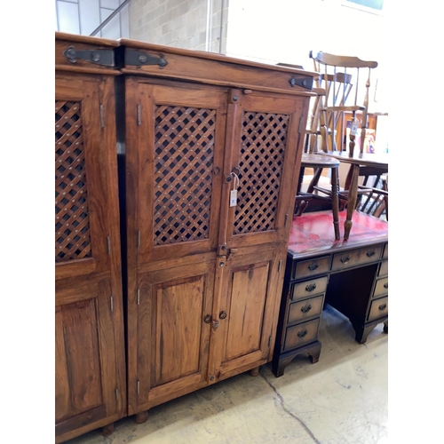 45 - A pair of Indonesian metal mounted hardwood wardrobes, width 85cm, depth 55cm, height 161cm