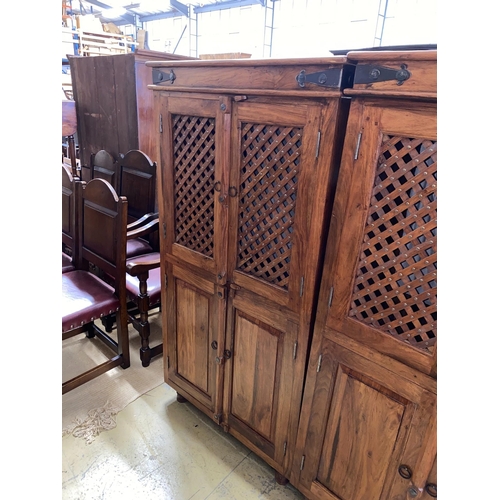 45 - A pair of Indonesian metal mounted hardwood wardrobes, width 85cm, depth 55cm, height 161cm