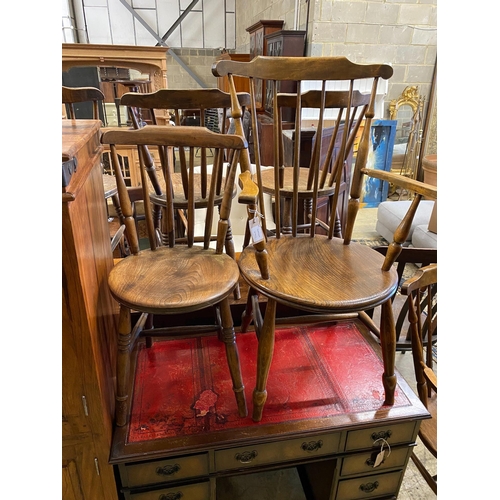 46 - An early 20th century harlequin set of six Windsor elm and beech dining chairs, two with arms