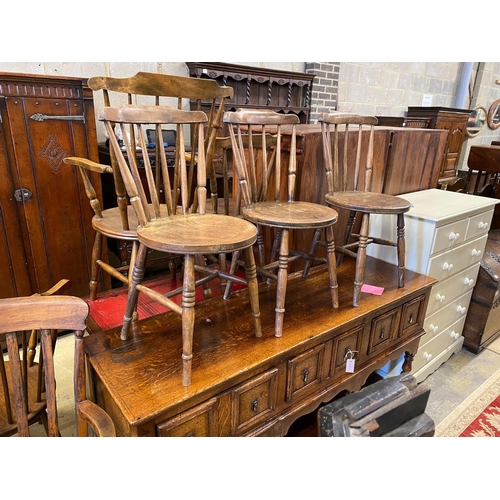 46 - An early 20th century harlequin set of six Windsor elm and beech dining chairs, two with arms