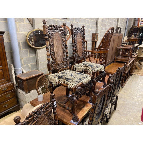 56 - A set of six Carolean style caned oak dining chairs, width 54cm, depth 46cm, height 121cm