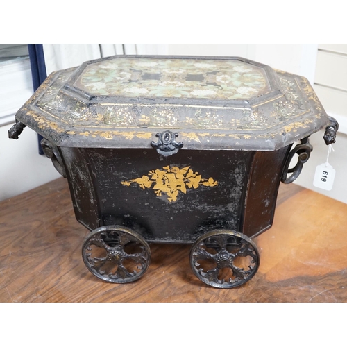 619 - A Victorian gilt lacquer coal scuttle on wheels with glass inset top, 63cm long