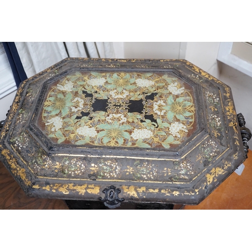619 - A Victorian gilt lacquer coal scuttle on wheels with glass inset top, 63cm long