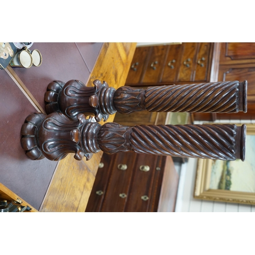 620 - A pair of William mahogany 'bedpost' candlestands