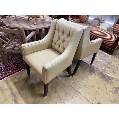 69 - A pair of contemporary armchairs with deep buttoned backs on ebonised underframes, width 64cm, depth... 