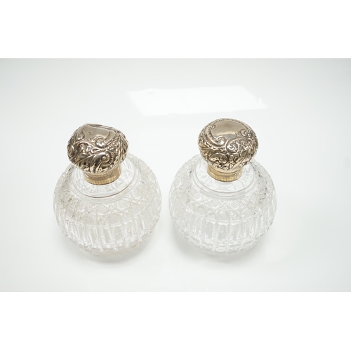 820 - A pair of late Victorian silver mounted cut glass globular scent bottles (a.f.), Haseler Brothers, B... 