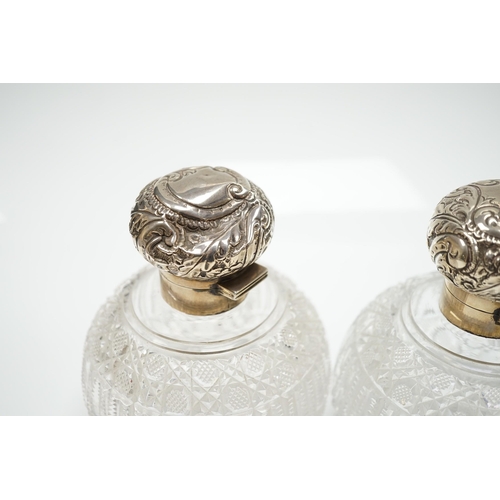 820 - A pair of late Victorian silver mounted cut glass globular scent bottles (a.f.), Haseler Brothers, B... 